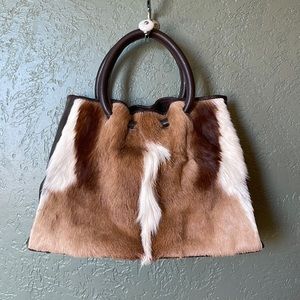 Purse with real gemsbok hide. Handles or strap. Lined inside